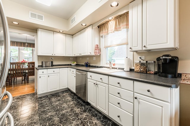 10 N Broadview Ave, Lombard, IL 60148 - kitchen featuring appliances with stainless steel finishes, dark countertops, a sink, white cabinets, and recessed lighting