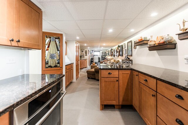 10 N Broadview Ave, Lombard, IL 60148 - kitchen with open shelves, brown cabinets, dark stone countertops, a paneled ceiling, and open floor plan