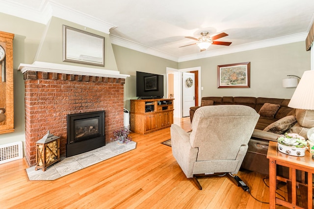 10 N Broadview Ave, Lombard, IL 60148 - living area with hardwood / wood-style floors, a brick fireplace, ceiling fan, and crown molding