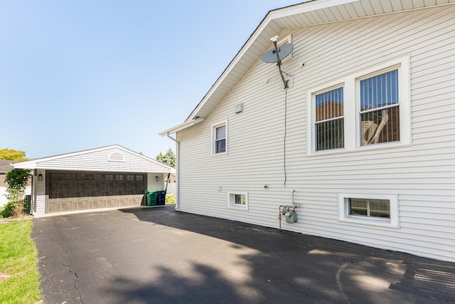 10 N Broadview Ave, Lombard, IL 60148 - view of side of home with a detached garage and an outbuilding
