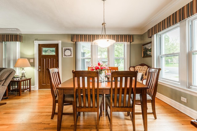 10 N Broadview Ave, Lombard, IL 60148 - dining space with baseboards, light wood finished floors, and crown molding