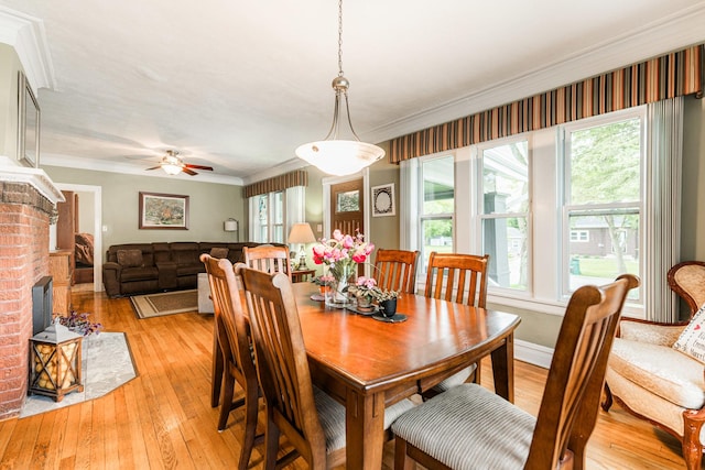 10 N Broadview Ave, Lombard, IL 60148 - dining area with ornamental molding, light wood-style flooring, ceiling fan, and a brick fireplace