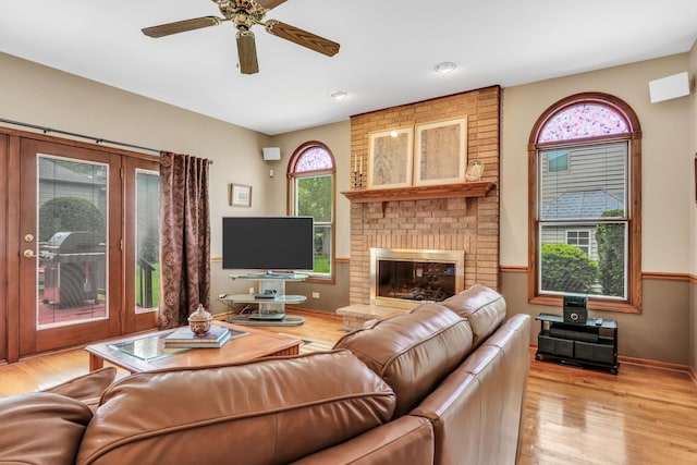 801 Fieldale Ln, Grayslake, IL 60030 - living room featuring light wood-style floors, a ceiling fan, a fireplace, baseboards, and recessed lighting