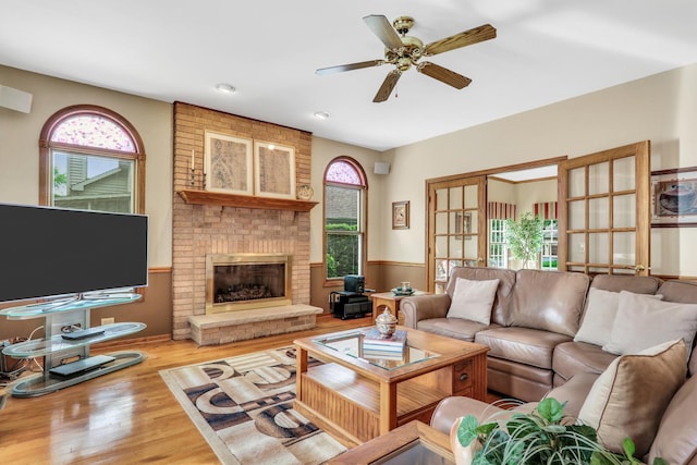 801 Fieldale Ln, Grayslake, IL 60030 - living room featuring ceiling fan, wood finished floors, a brick fireplace, and recessed lighting