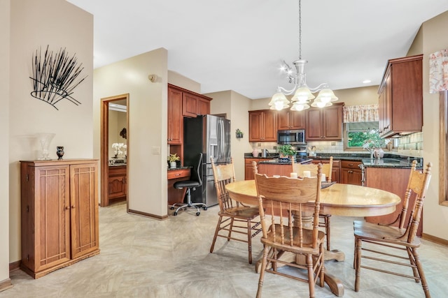 801 Fieldale Ln, Grayslake, IL 60030 - dining space featuring a chandelier, an office area, and baseboards