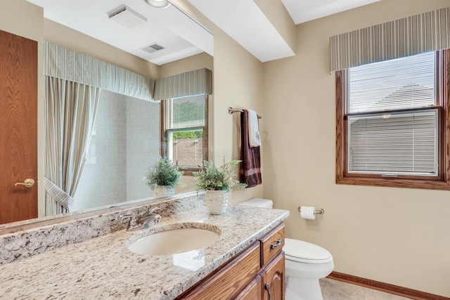 801 Fieldale Ln, Grayslake, IL 60030 - bathroom with toilet, vanity, baseboards, a shower with curtain, and tile patterned floors