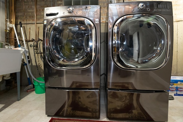 9330 Kolmar Ave, Skokie, IL 60076 - laundry area with washer and dryer and tile patterned floors