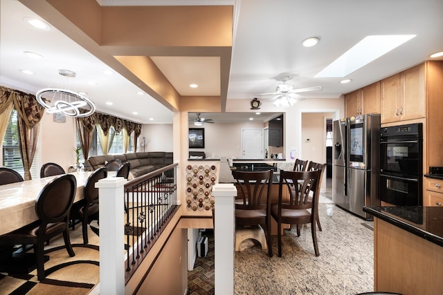 9330 Kolmar Ave, Skokie, IL 60076 - dining room featuring recessed lighting, ceiling fan, a skylight, and ornamental molding