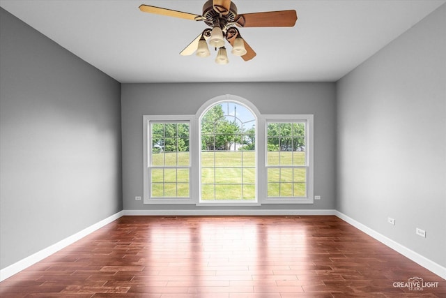 800 Diamond Head Dr E, Shorewood, IL 60404 - spare room featuring dark wood-style flooring, baseboards, and ceiling fan
