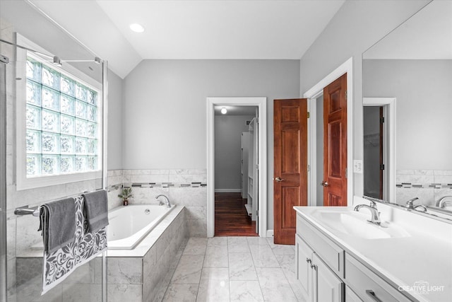 800 Diamond Head Dr E, Shorewood, IL 60404 - bathroom with vanity, a bath, healthy amount of natural light, marble look tile flooring, and lofted ceiling