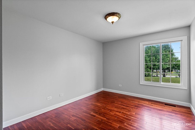 800 Diamond Head Dr E, Shorewood, IL 60404 - unfurnished room featuring baseboards and dark wood-type flooring