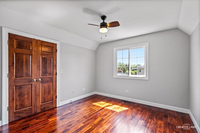 800 Diamond Head Dr E, Shorewood, IL 60404 - unfurnished bedroom with vaulted ceiling, baseboards, dark wood-style flooring, and a ceiling fan