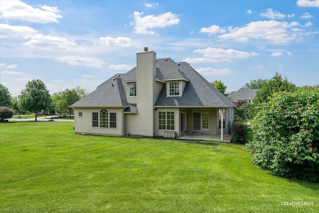 800 Diamond Head Dr E, Shorewood, IL 60404 - back of property featuring a patio area, a yard, a chimney, and roof with shingles