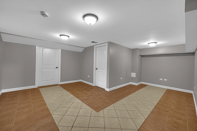 20738 S Hickory Creek Ct, Frankfort, IL 60423 - finished basement featuring light tile patterned floors and baseboards