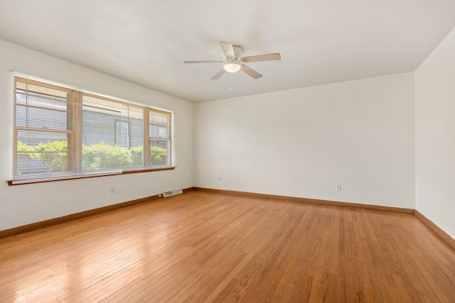 3229 Liberty Dr, Rockford, IL 61101 - unfurnished room with light wood-type flooring, a ceiling fan, and baseboards