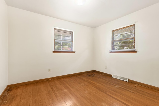 3229 Liberty Dr, Rockford, IL 61101 - unfurnished room featuring plenty of natural light, light wood finished floors, and baseboards