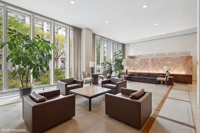 3550 N Lake Shore Dr Unit 1901, Chicago, IL 60657 - community lobby with floor to ceiling windows and recessed lighting