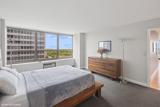 3550 N Lake Shore Dr Unit 1901, Chicago, IL 60657 - carpeted bedroom with baseboards and a wall mounted air conditioner