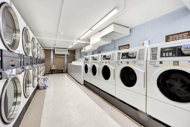 3550 N Lake Shore Dr Unit 1901, Chicago, IL 60657 - communal laundry room with stacked washing machine and dryer and washing machine and clothes dryer