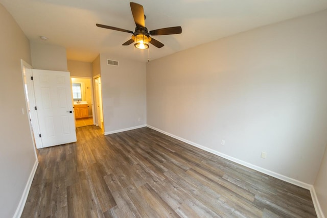 2433 River Oaks Ln Unit 6, Rockford, IL 61102 - spare room with dark wood-style floors, a ceiling fan, and baseboards