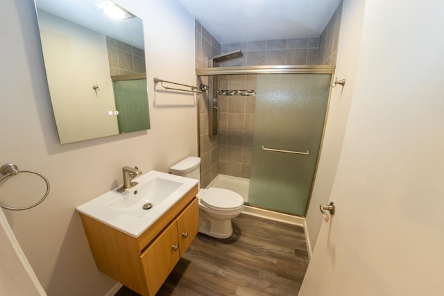 2433 River Oaks Ln Unit 6, Rockford, IL 61102 - full bathroom with toilet, a shower stall, vanity, and wood finished floors