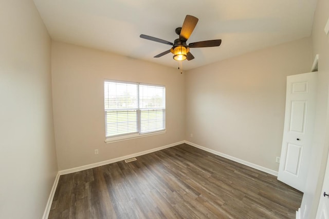 2433 River Oaks Ln Unit 6, Rockford, IL 61102 - empty room featuring baseboards, dark wood finished floors, and ceiling fan