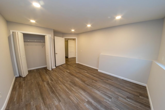 2433 River Oaks Ln Unit 6, Rockford, IL 61102 - unfurnished bedroom with dark wood-style floors, baseboards, a closet, and recessed lighting