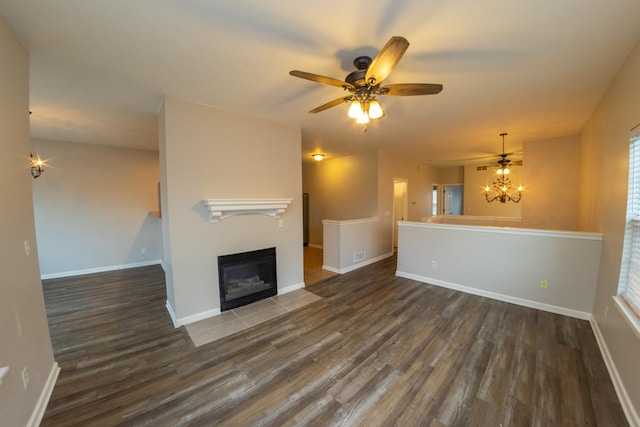 2433 River Oaks Ln Unit 6, Rockford, IL 61102 - unfurnished living room featuring wood finished floors, baseboards, and a fireplace with flush hearth