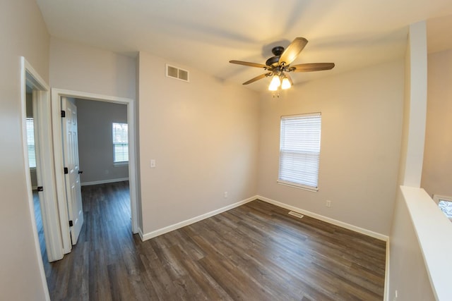 2433 River Oaks Ln Unit 6, Rockford, IL 61102 - unfurnished room with ceiling fan, dark wood-style flooring, and baseboards