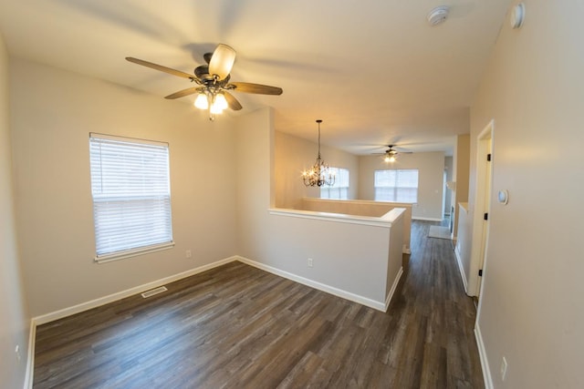 2433 River Oaks Ln Unit 6, Rockford, IL 61102 - unfurnished room with a smoke detector, dark wood-style flooring, a ceiling fan, and baseboards