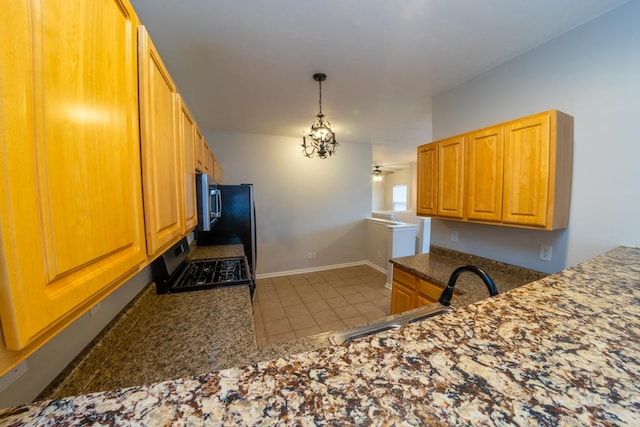 2433 River Oaks Ln Unit 6, Rockford, IL 61102 - kitchen featuring gas stove, a sink, pendant lighting, tile patterned floors, and stainless steel microwave