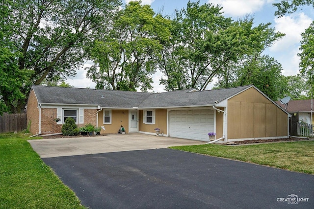 125 S Pinecrest Rd, Bolingbrook, IL 60440 - ranch-style house featuring driveway, an attached garage, and brick siding