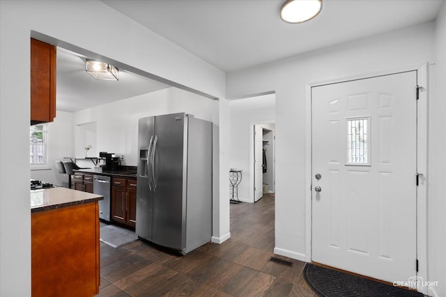 125 S Pinecrest Rd, Bolingbrook, IL 60440 - kitchen featuring appliances with stainless steel finishes, dark countertops, and dark wood-type flooring