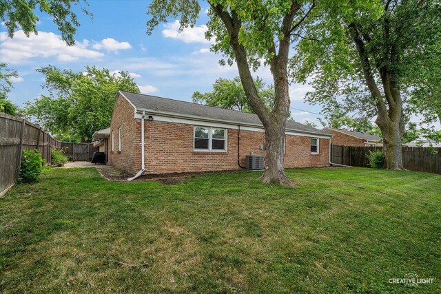 125 S Pinecrest Rd, Bolingbrook, IL 60440 - rear view of house featuring brick siding and a fenced backyard