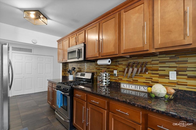 125 S Pinecrest Rd, Bolingbrook, IL 60440 - kitchen featuring appliances with stainless steel finishes, tasteful backsplash, brown cabinetry, and dark stone counters