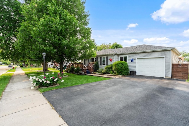 1211 Schriber Ave, Joliet, IL 60435 - view of front facade featuring a garage, driveway, and a front yard