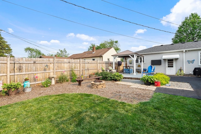 1211 Schriber Ave, Joliet, IL 60435 - fenced backyard with a gazebo and a fire pit