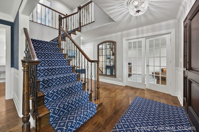 112 Danada Dr, Wheaton, IL 60189 - stairway with wood finished floors, a chandelier, ornamental molding, french doors, and baseboards