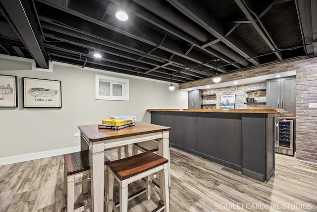 112 Danada Dr, Wheaton, IL 60189 - indoor wet bar with beverage cooler, brick wall, light wood-style floors, and baseboards
