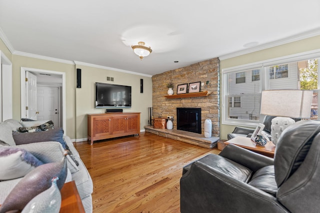 846 Park Dr, Flossmoor, IL 60422 - living room featuring crown molding, light wood-type flooring, a stone fireplace, and baseboards