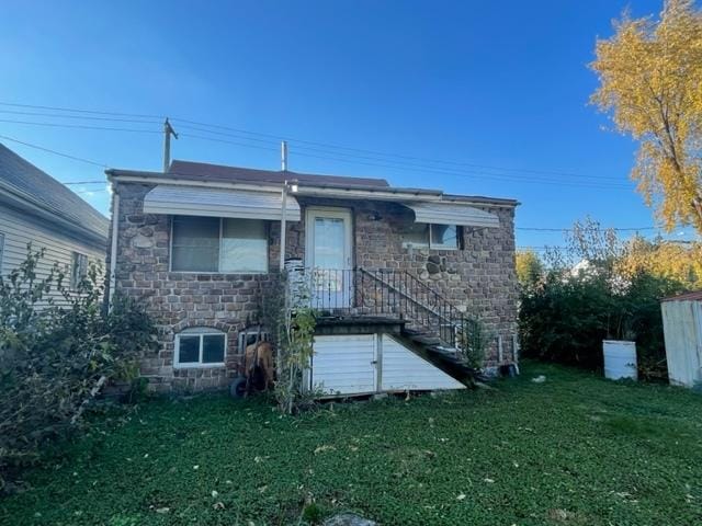 4932 S Laramie Ave, Chicago, IL 60638 - rear view of house featuring stone siding and a lawn