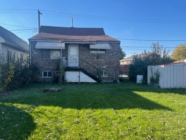 4932 S Laramie Ave, Chicago, IL 60638 - rear view of house with a lawn and stone siding