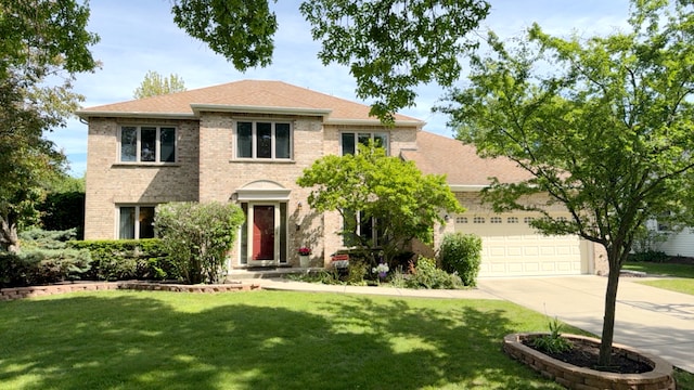 1463 Lantern Cir, Naperville, IL 60540 - view of front of property featuring driveway, an attached garage, a front lawn, and brick siding