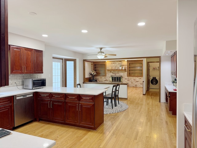 1463 Lantern Cir, Naperville, IL 60540 - kitchen with stainless steel appliances, dark brown cabinets, light countertops, and recessed lighting