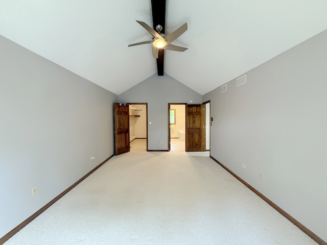 1463 Lantern Cir, Naperville, IL 60540 - unfurnished bedroom featuring a walk in closet, baseboards, and light carpet