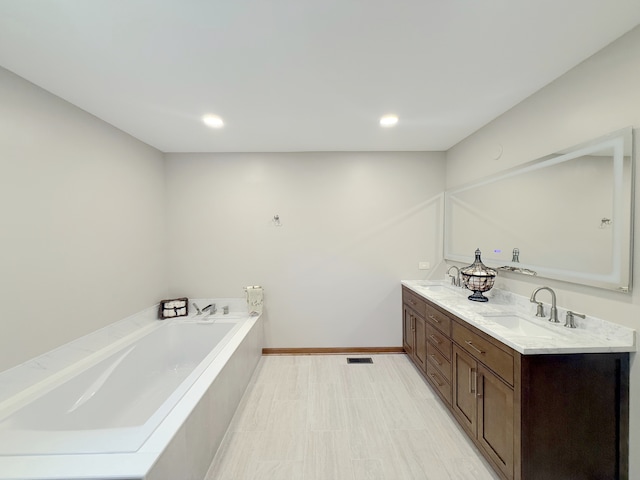 1463 Lantern Cir, Naperville, IL 60540 - bathroom featuring a bath, double vanity, baseboards, and recessed lighting