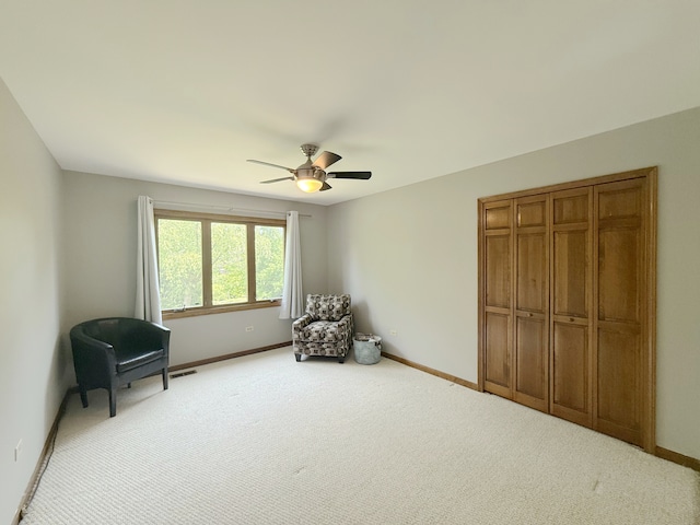 1463 Lantern Cir, Naperville, IL 60540 - sitting room with baseboards, a ceiling fan, and carpet flooring