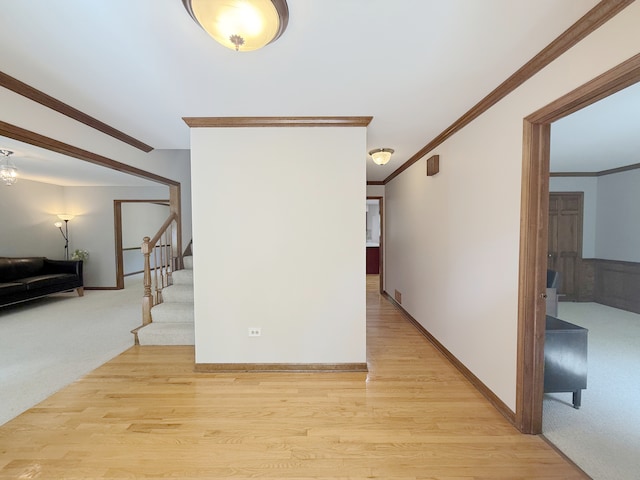 1463 Lantern Cir, Naperville, IL 60540 - hallway featuring stairs, light wood finished floors, crown molding, and baseboards