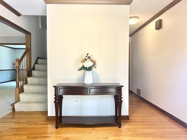 1463 Lantern Cir, Naperville, IL 60540 - hallway with stairs, wood finished floors, crown molding, and baseboards