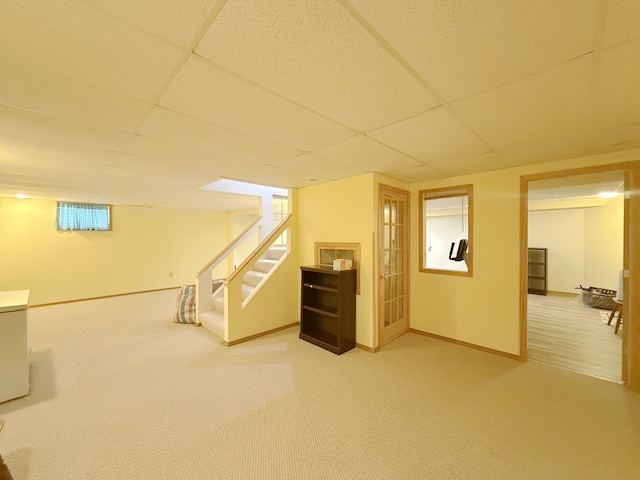 1463 Lantern Cir, Naperville, IL 60540 - basement featuring stairs, a paneled ceiling, carpet flooring, and baseboards